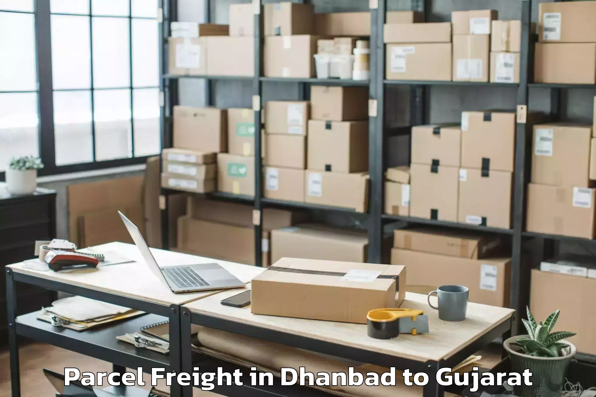 Book Your Dhanbad to Gujarat National Law Universit Parcel Freight Today